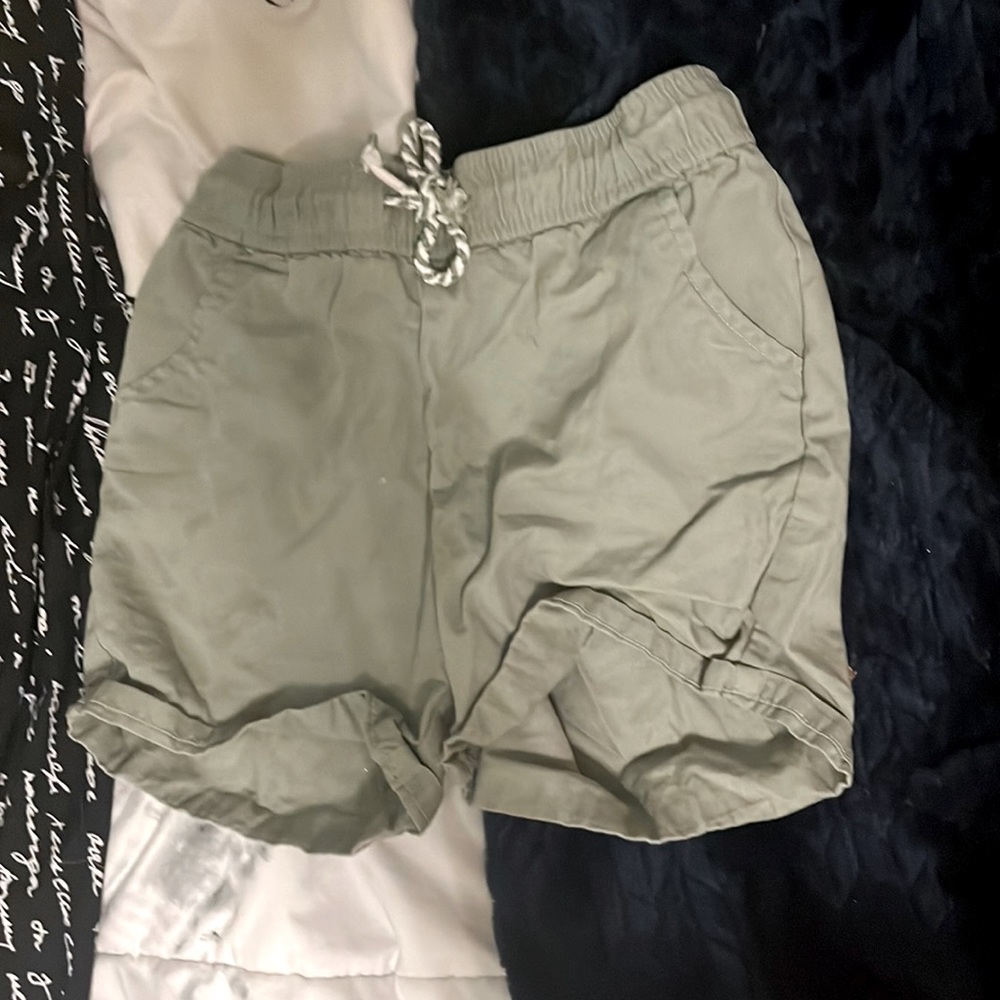 Sage green adjustable shorts with back & front pockets.